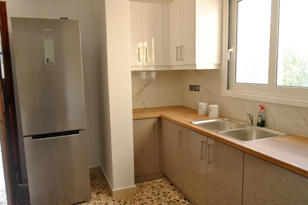 Kuchyň nebo kuchyňský kout v ubytování Giovana's pool house