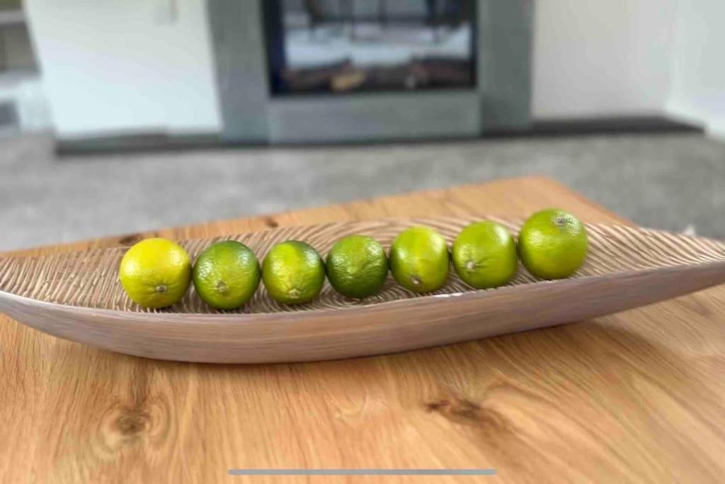 a group of limes on a wooden cutting board at Seven Limes in Southwell