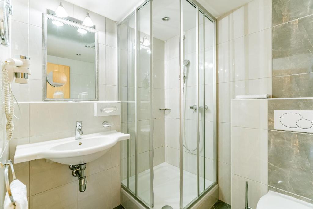 Koupelna v ubytování Hotel Huberhof