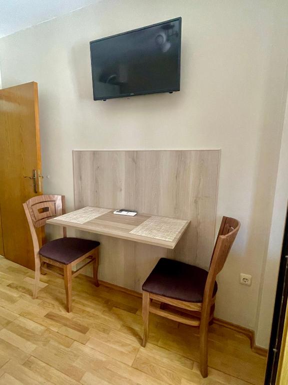 TV a/nebo společenská místnost v ubytování Sunny