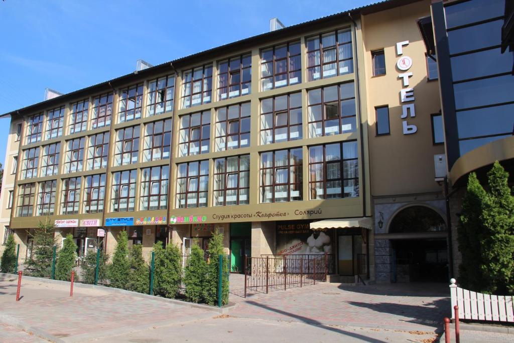 a large building on a city street at Misteriya Hotel in Kharkiv