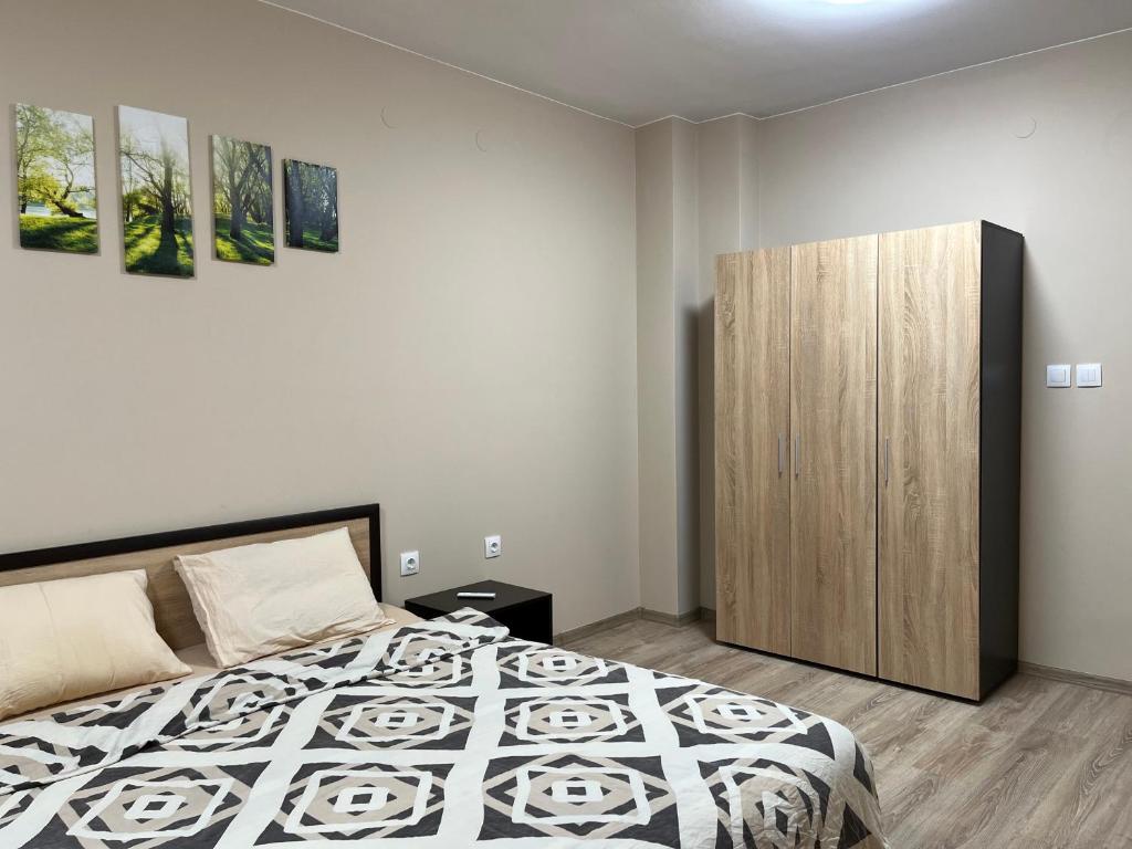 Postel nebo postele na pokoji v ubytování Georgievi Apartments Sandanski