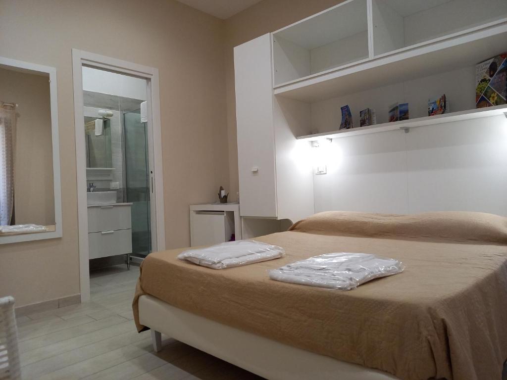 A bed or beds in a room at M & M