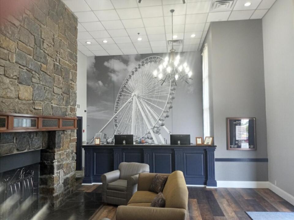 a lobby with a large ferris wheel on the wall at Barrington Hotel & Suites in Branson