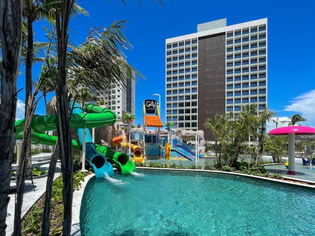 a pool at a resort with a water slide at SALINAS PREMIUM - GAV Resorts in Salinópolis