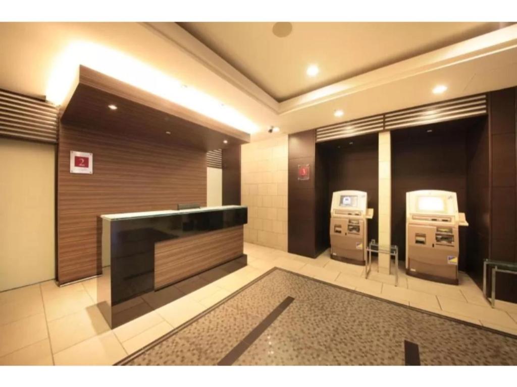 R&B HOTEL HACHIOJI - Vacation STAY 38819vにあるテレビまたはエンターテインメントセンター