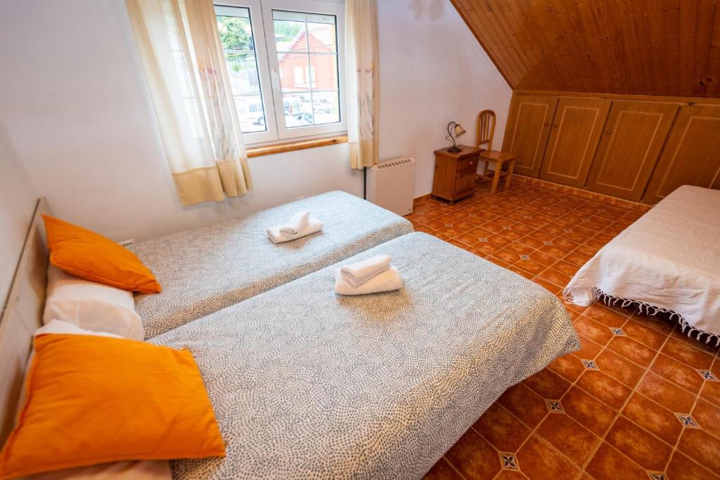 Cama o camas de una habitación en Apartamentos Cudillero