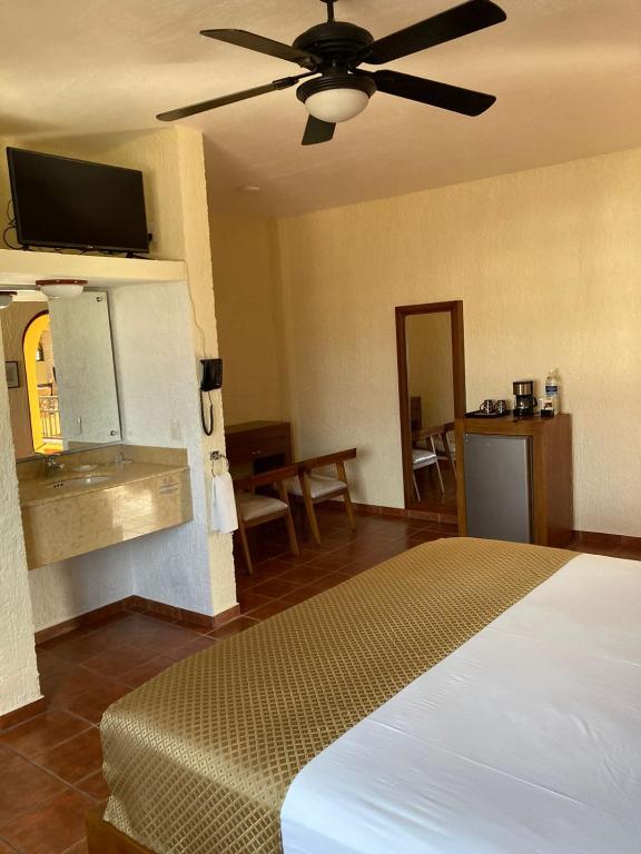Postel nebo postele na pokoji v ubytování HOTEL CASA DE LAS PALOMAS