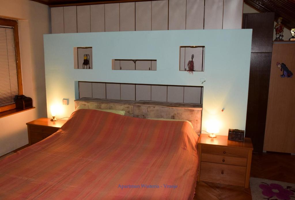 Postel nebo postele na pokoji v ubytování Apartman Wisteria