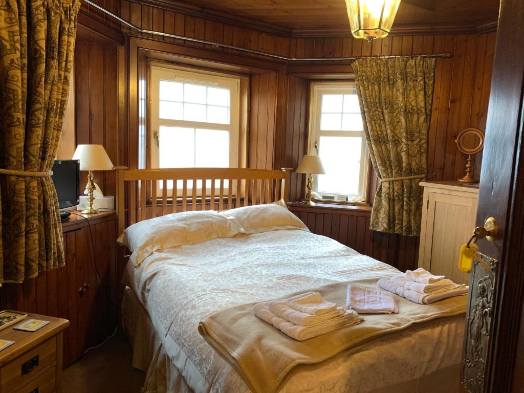 Postel nebo postele na pokoji v ubytování Dunivaig B&B