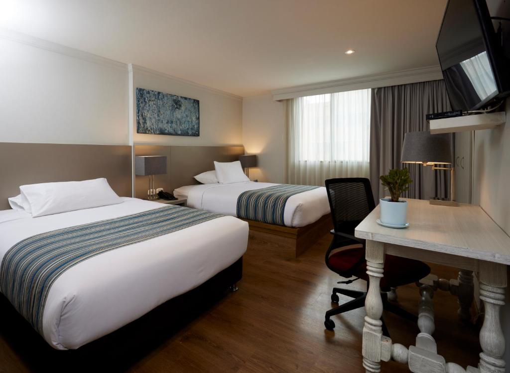 Postel nebo postele na pokoji v ubytování Hotel Saint Simon