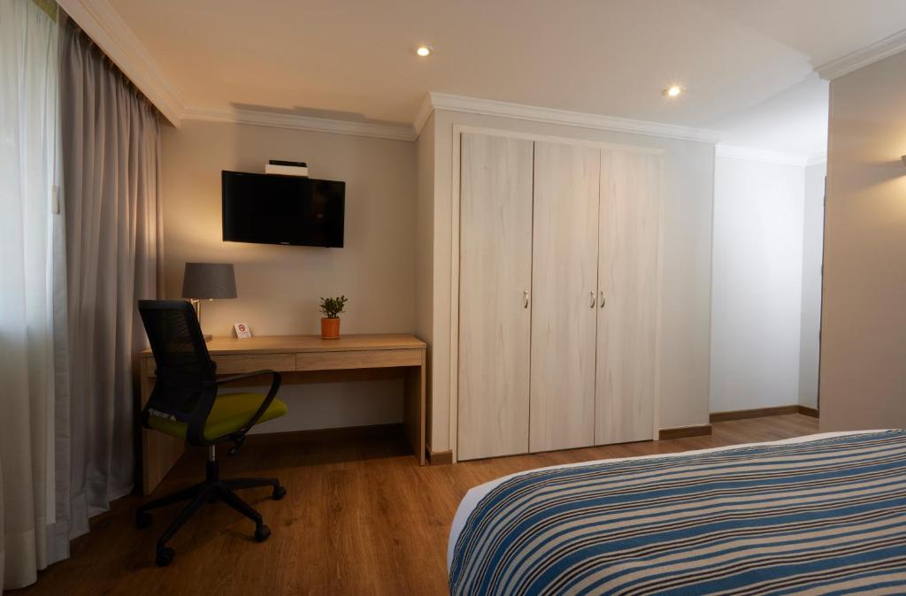 TV a/nebo společenská místnost v ubytování Hotel Saint Simon