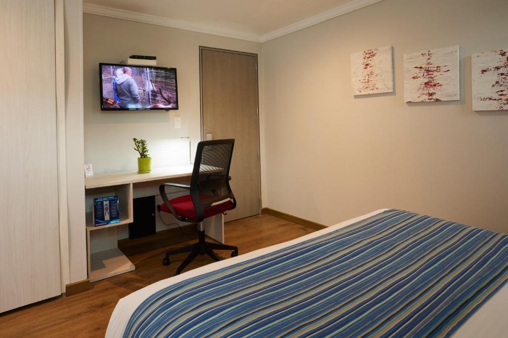 TV a/nebo společenská místnost v ubytování Hotel Saint Simon