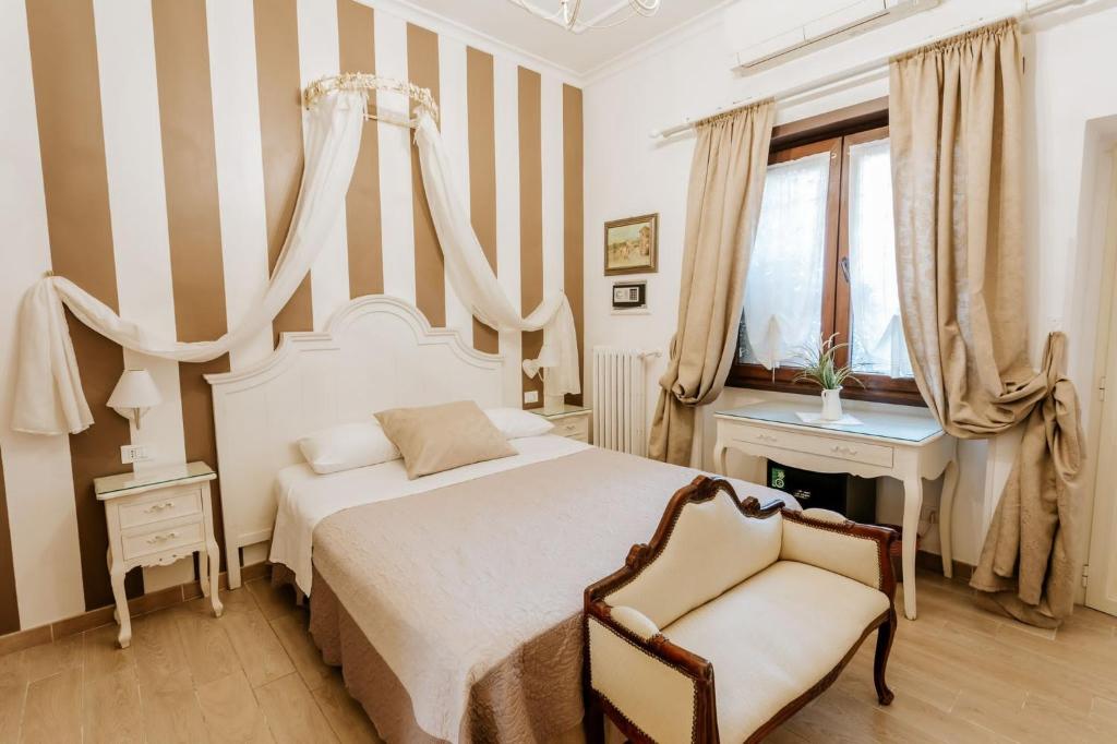 Cama o camas de una habitación en Vatican Boutique inn