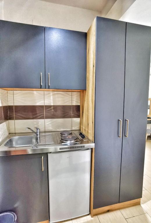 Kuchyň nebo kuchyňský kout v ubytování MD APARTMENTS