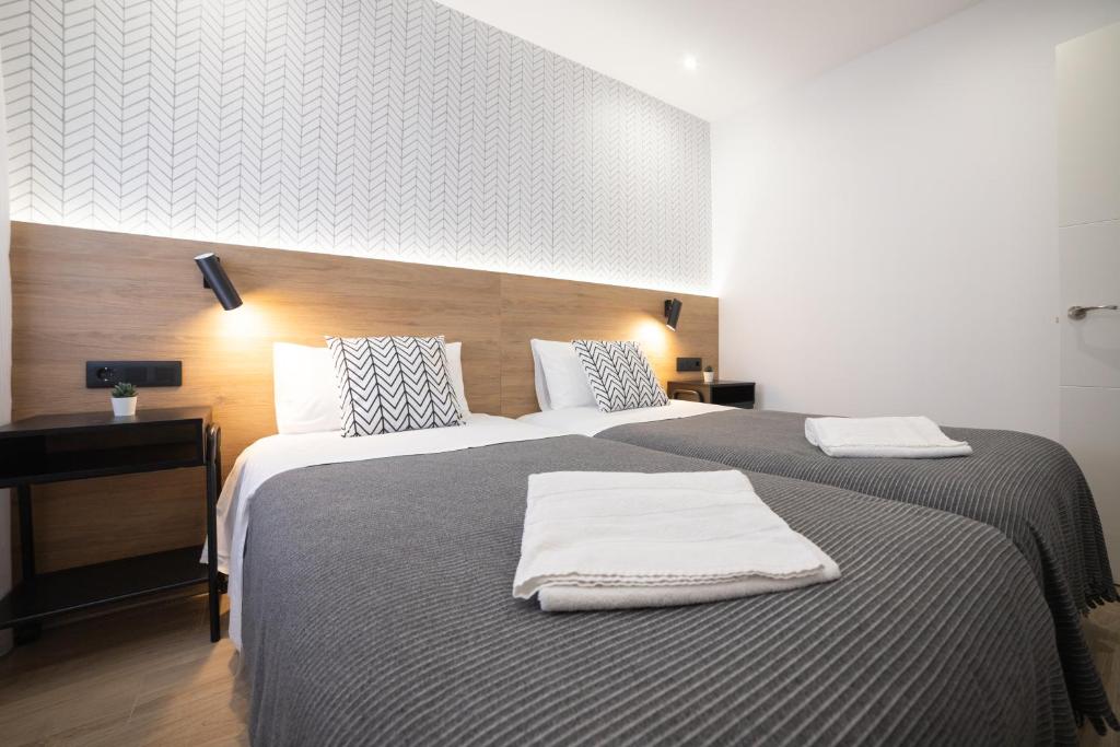 Postel nebo postele na pokoji v ubytování Apartamento Logroño Plaza Ayuntamiento
