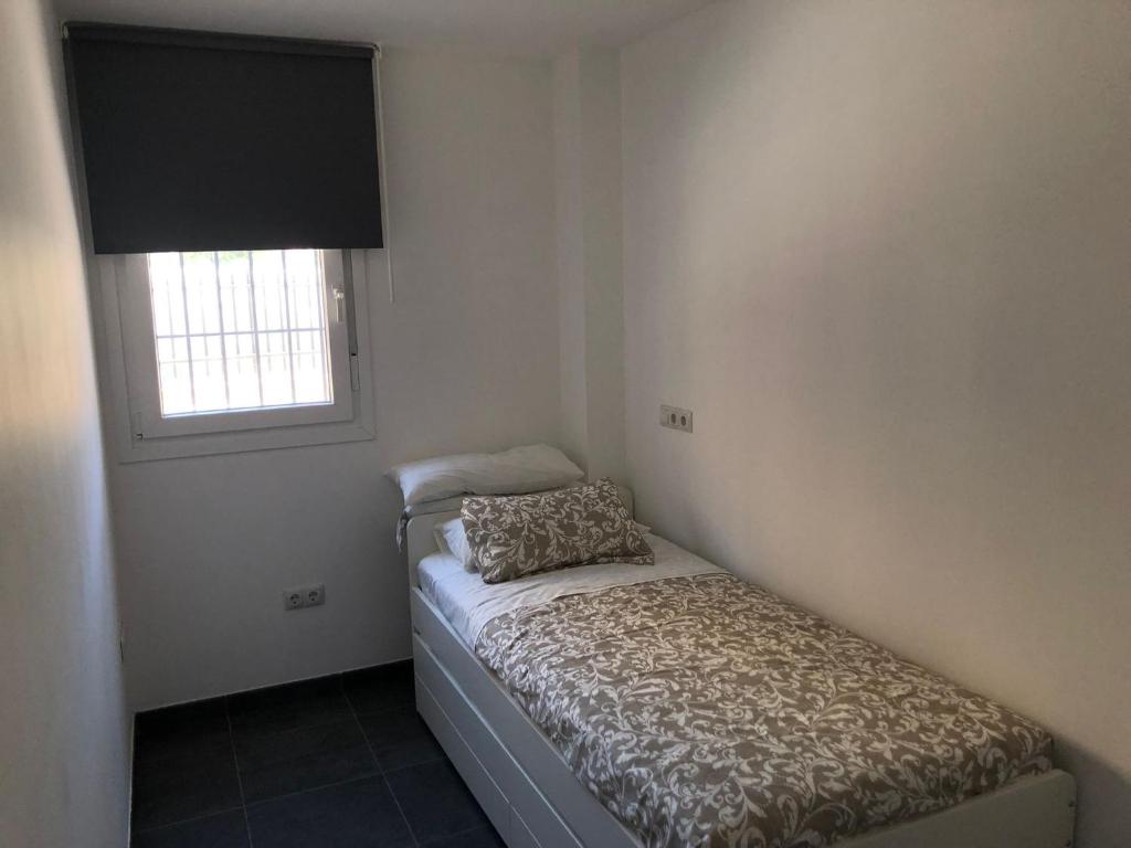 A bed or beds in a room at La Casita
