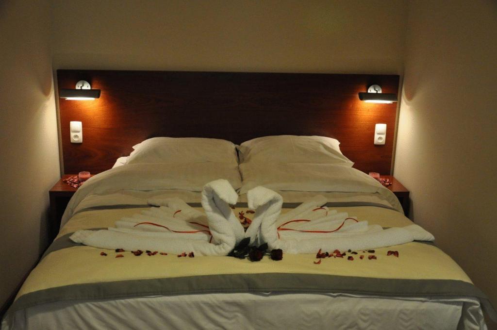 Posteľ alebo postele v izbe v ubytovaní Hotel Atrium