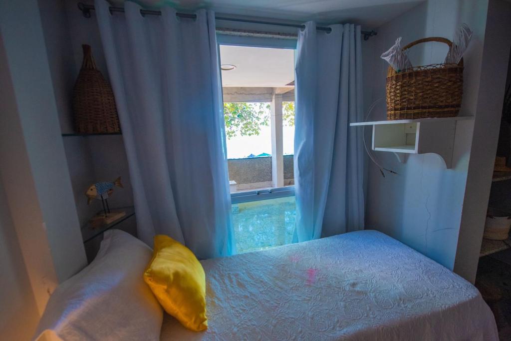 Voodi või voodid majutusasutuse Casa com pes na areia em Iriri - ES toas