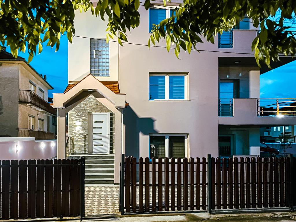 a house with a fence in front of it at PRILEP NEW BEST APARTMENTS in Prilep