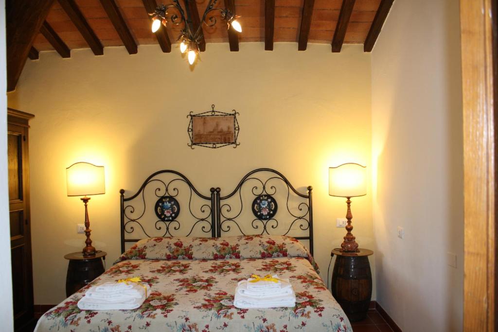 Łóżko lub łóżka w pokoju w obiekcie Agriturismo Borgo Il Bonagino