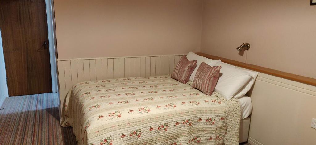 Postel nebo postele na pokoji v ubytování Teac Campbell Guesthouse