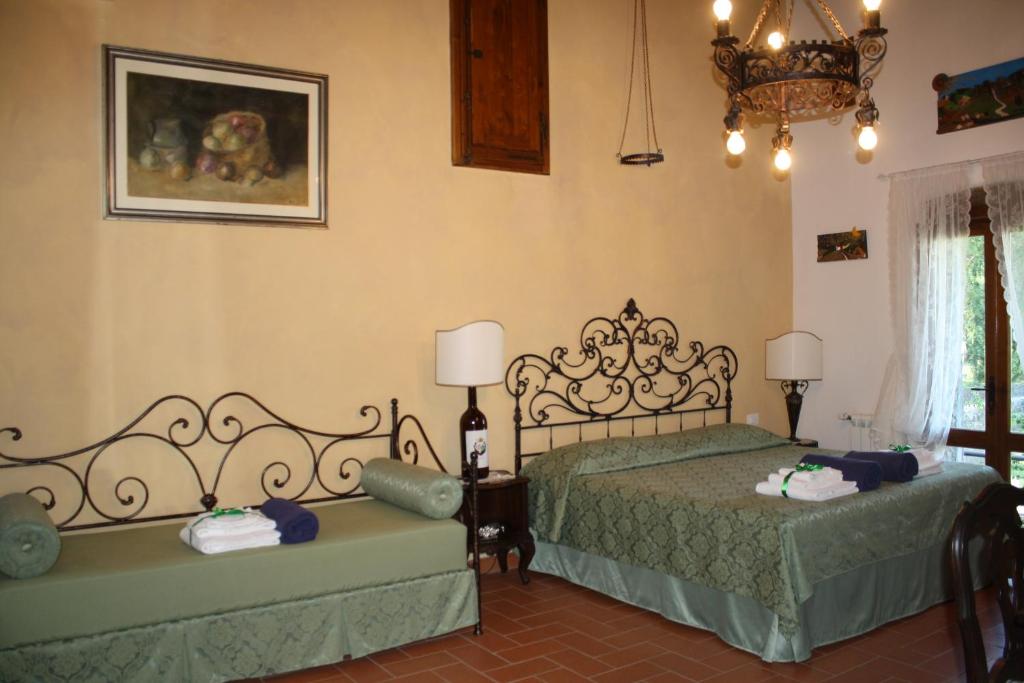 Łóżko lub łóżka w pokoju w obiekcie Agriturismo Borgo Il Bonagino