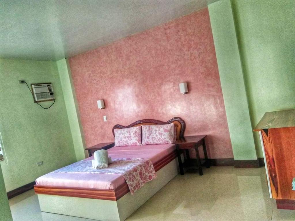 Postel nebo postele na pokoji v ubytování Calicoan Villa