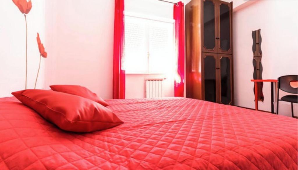 Posteľ alebo postele v izbe v ubytovaní Take It Easy Roma Guest House
