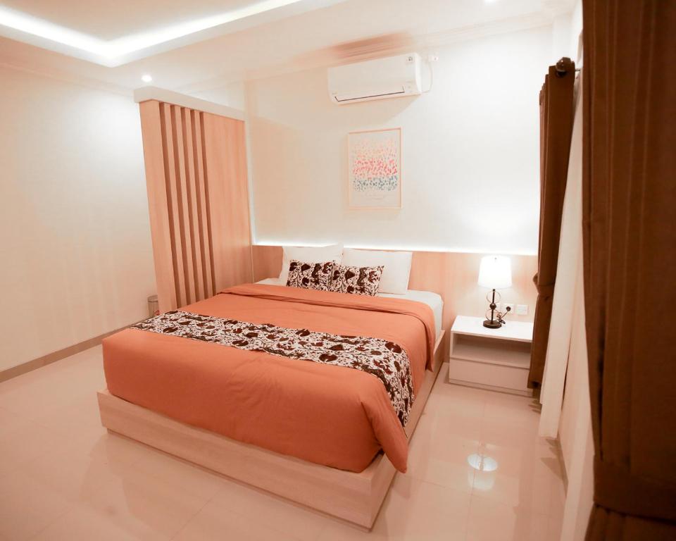 En eller flere senge i et værelse på Omah Nayan