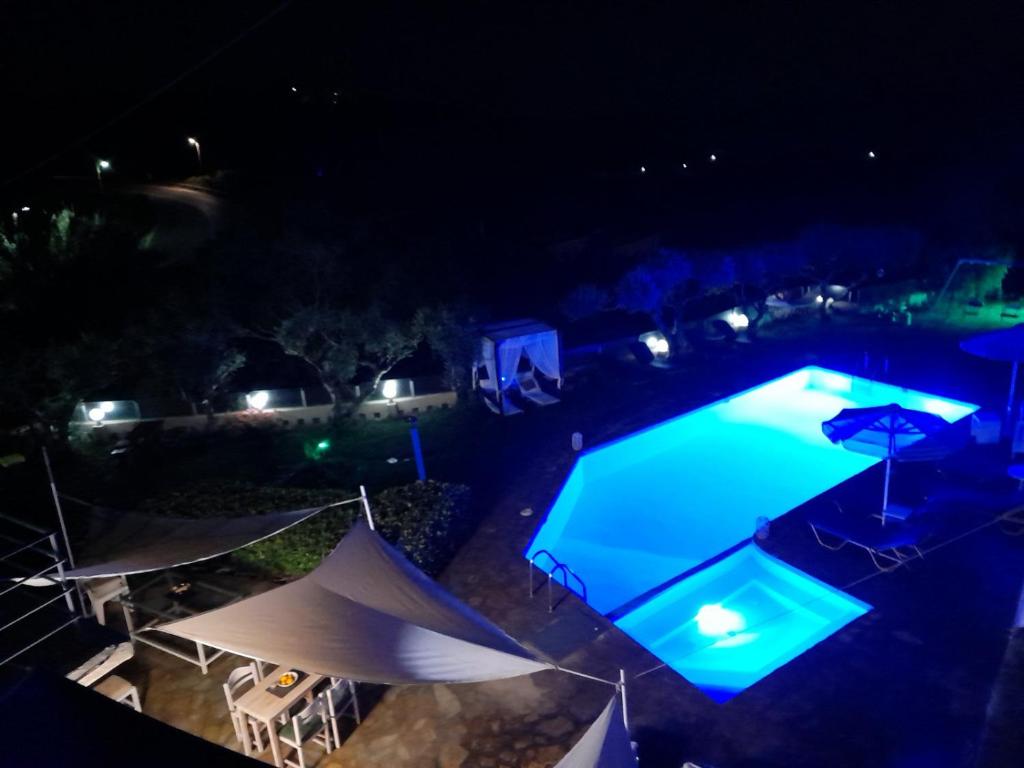 an overhead view of a swimming pool at night at Asimina in Istro