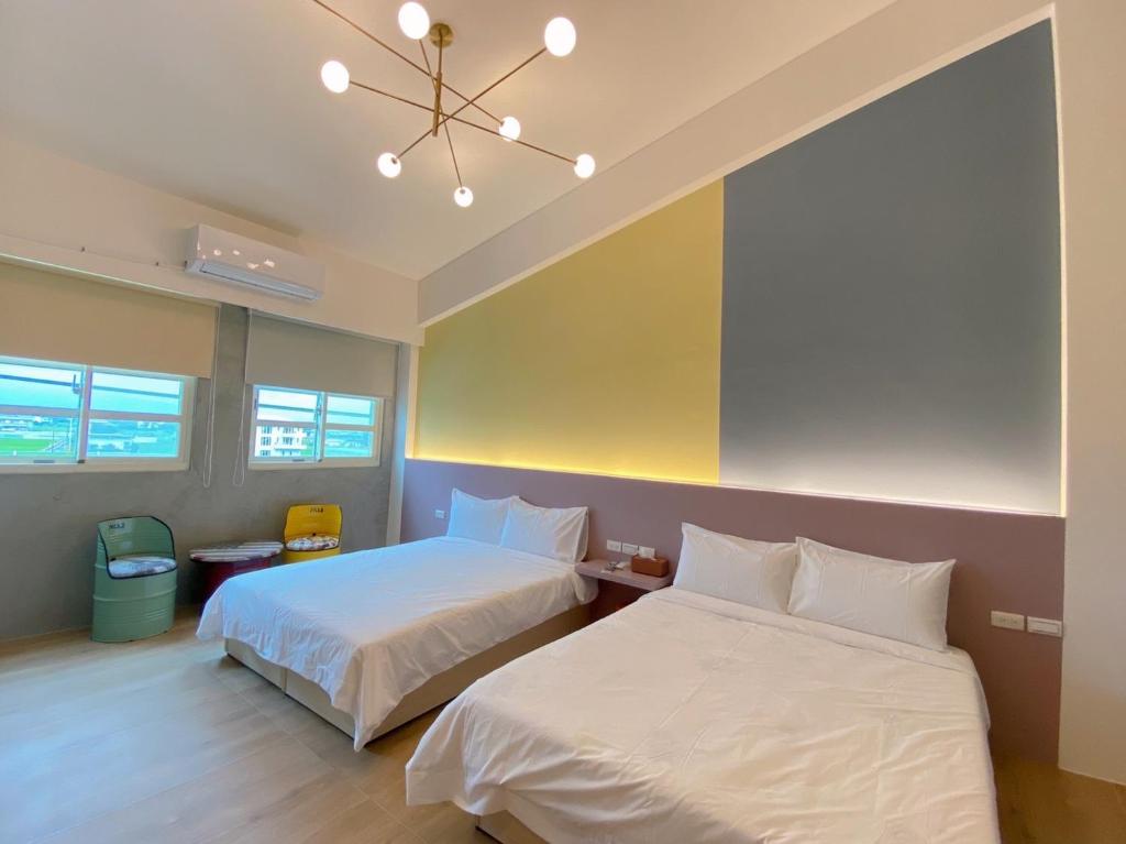 Ένα ή περισσότερα κρεβάτια σε δωμάτιο στο Xiangdao