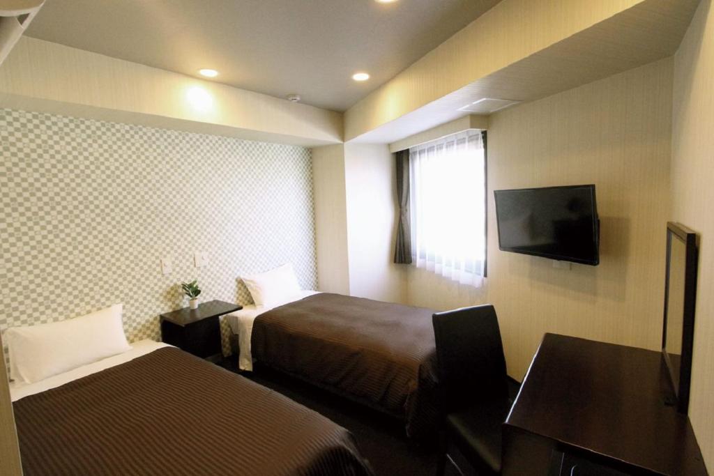 TV a/nebo společenská místnost v ubytování HOTEL LiVEMAX Nihonbashi Hakozaki