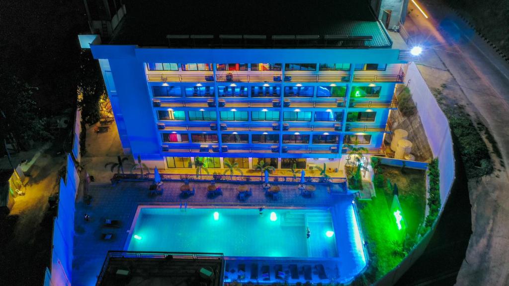 an overhead view of a hotel with a swimming pool at night at Villa Israel Ecopark El Nido in El Nido