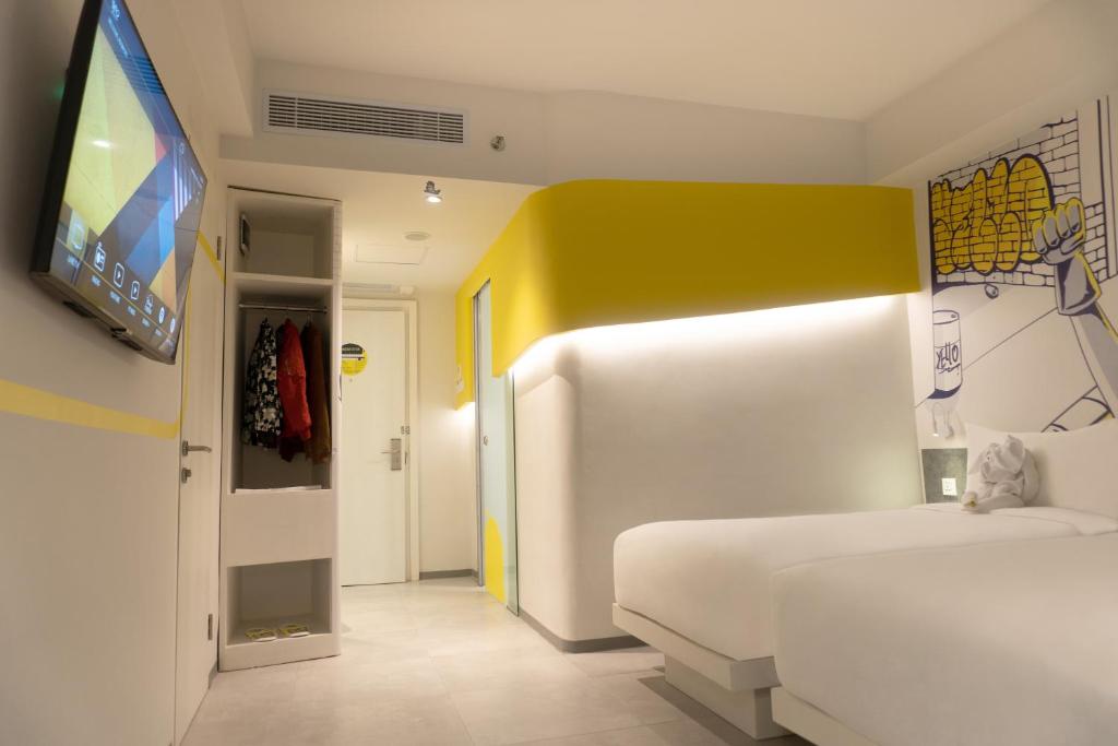 Postel nebo postele na pokoji v ubytování Yello Hotel Jambi
