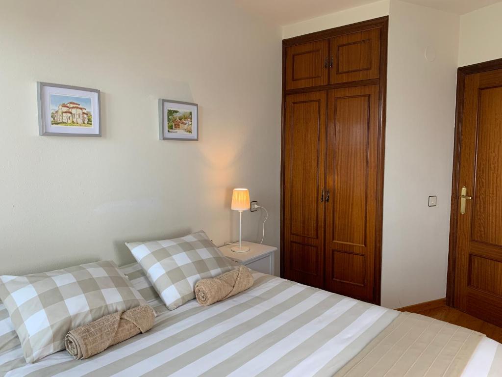 A bed or beds in a room at El Puerto