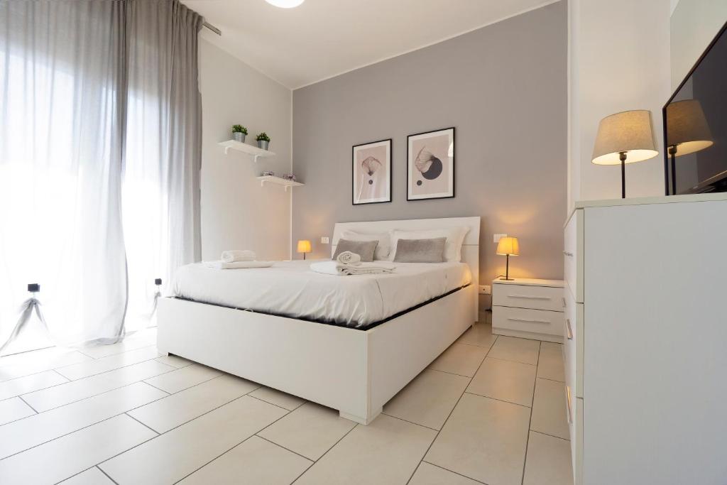 A bed or beds in a room at GetTheKey Pasubio Apartment