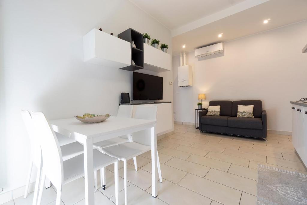 A television and/or entertainment centre at GetTheKey Pasubio Apartment