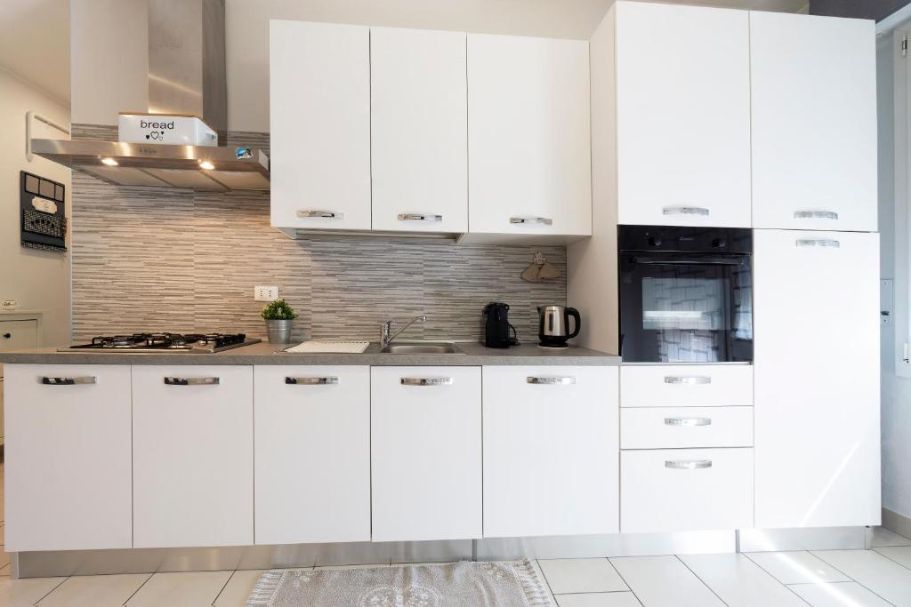 A kitchen or kitchenette at GetTheKey Pasubio Apartment
