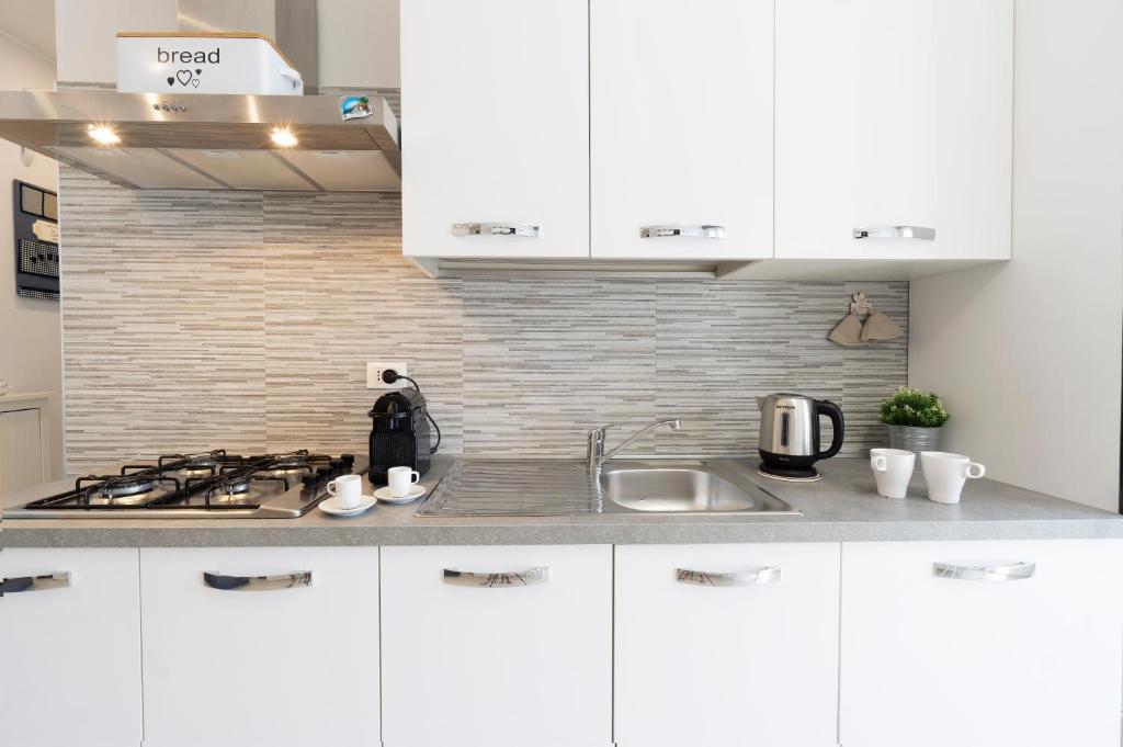 A kitchen or kitchenette at GetTheKey Pasubio Apartment