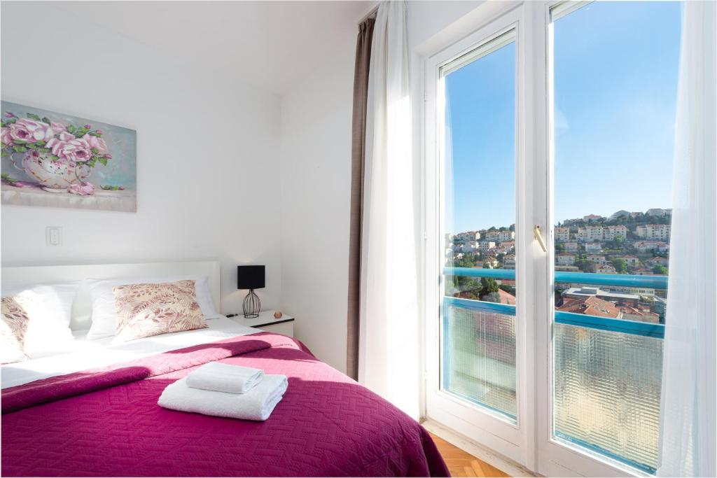 Posteľ alebo postele v izbe v ubytovaní Apartment Sunset free parking