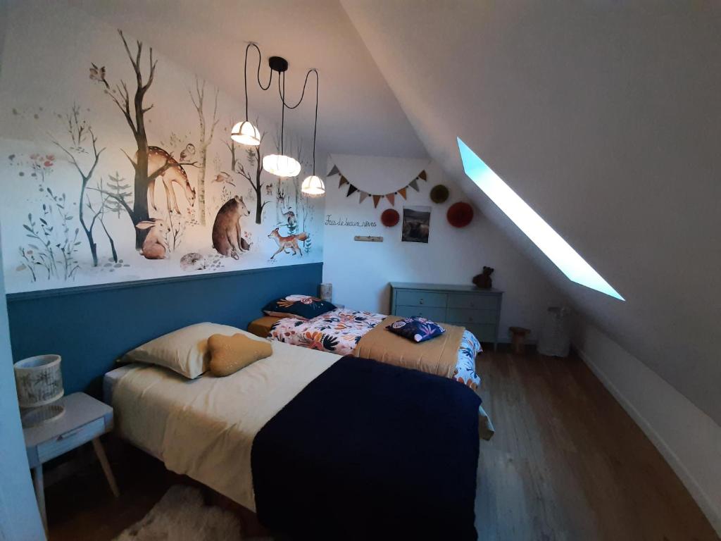 Posteľ alebo postele v izbe v ubytovaní Le Cottage du Bois Flotté