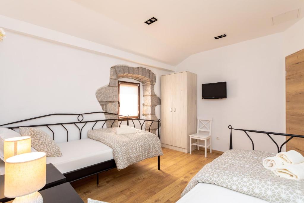 Postel nebo postele na pokoji v ubytování Holiday house PAVOVCI