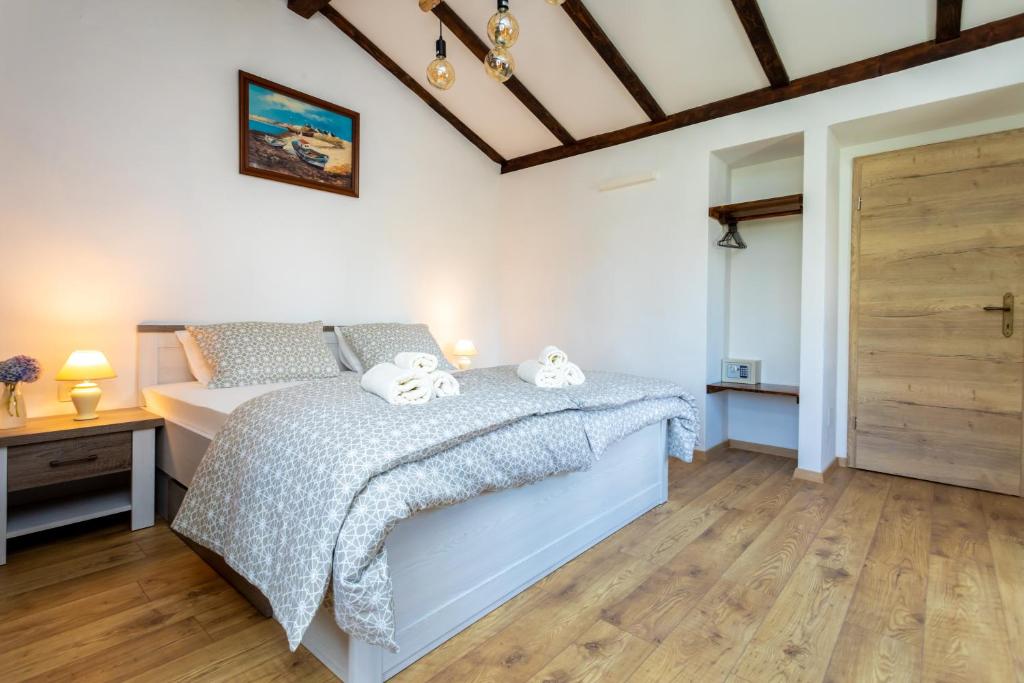 Postel nebo postele na pokoji v ubytování Holiday house PAVOVCI