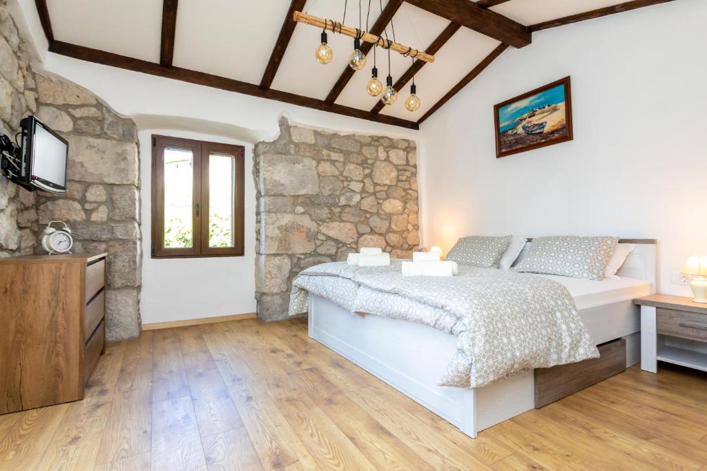 Postel nebo postele na pokoji v ubytování Holiday house PAVOVCI