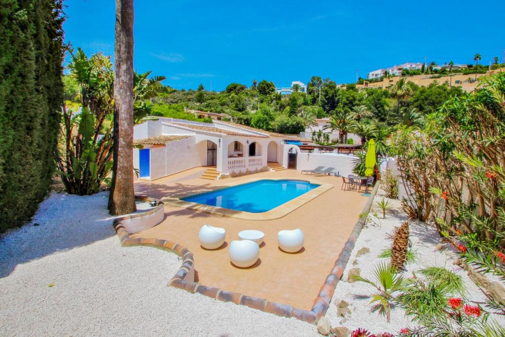 an aerial view of a house with a swimming pool at Colina - holiday home with private swimming pool in Moraira in Moraira