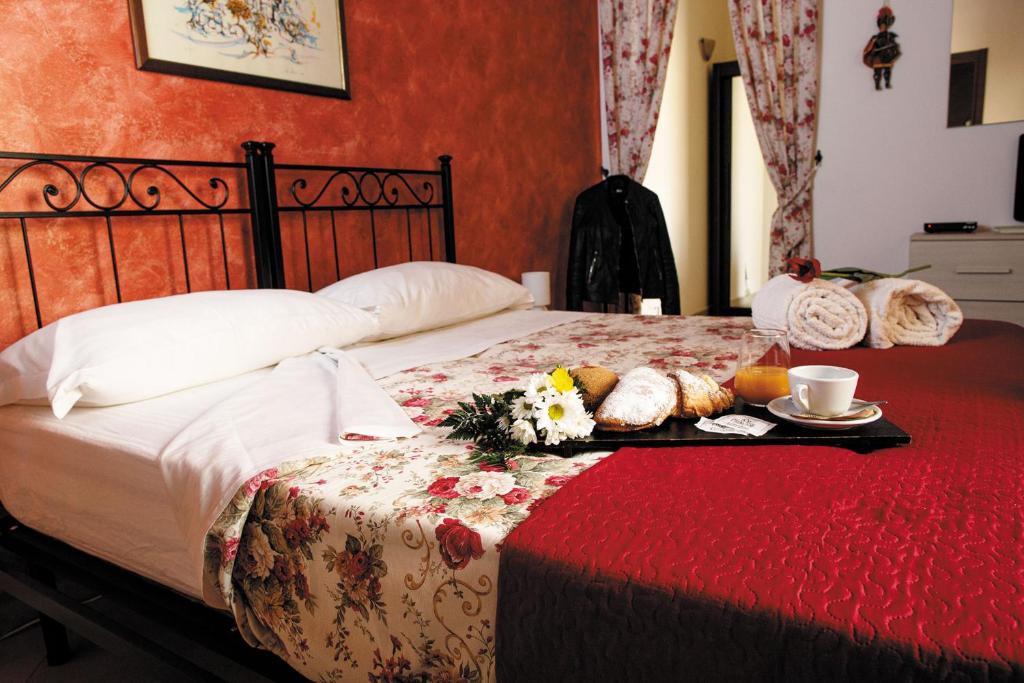 Postel nebo postele na pokoji v ubytování B&B Principe Augusta