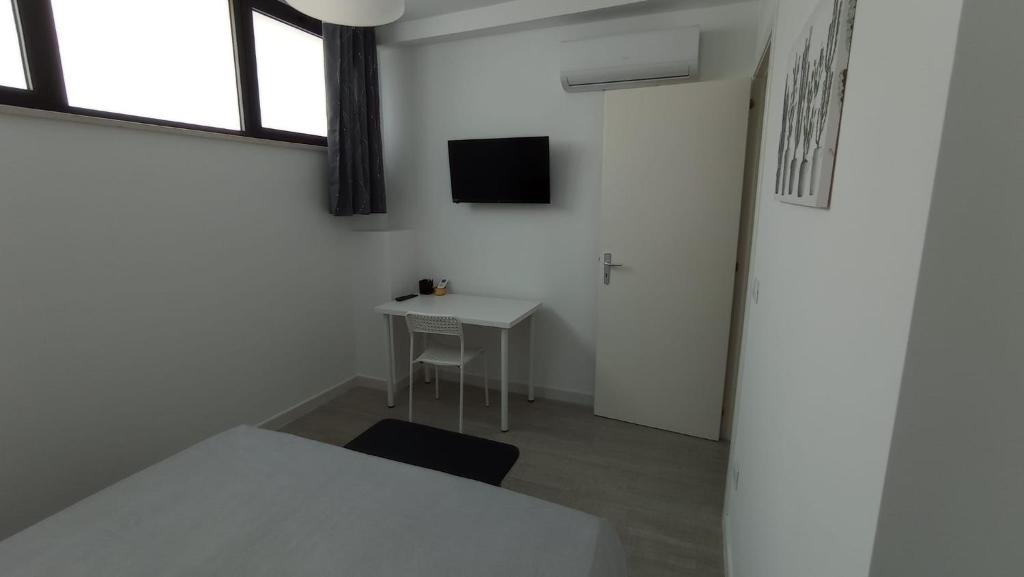Telewizja i/lub zestaw kina domowego w obiekcie Rosa's Rooms
