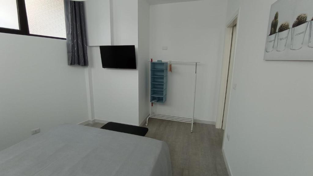 Łóżko lub łóżka w pokoju w obiekcie Rosa's Rooms