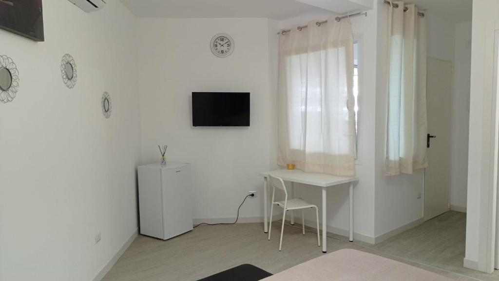 Telewizja i/lub zestaw kina domowego w obiekcie Rosa's Rooms